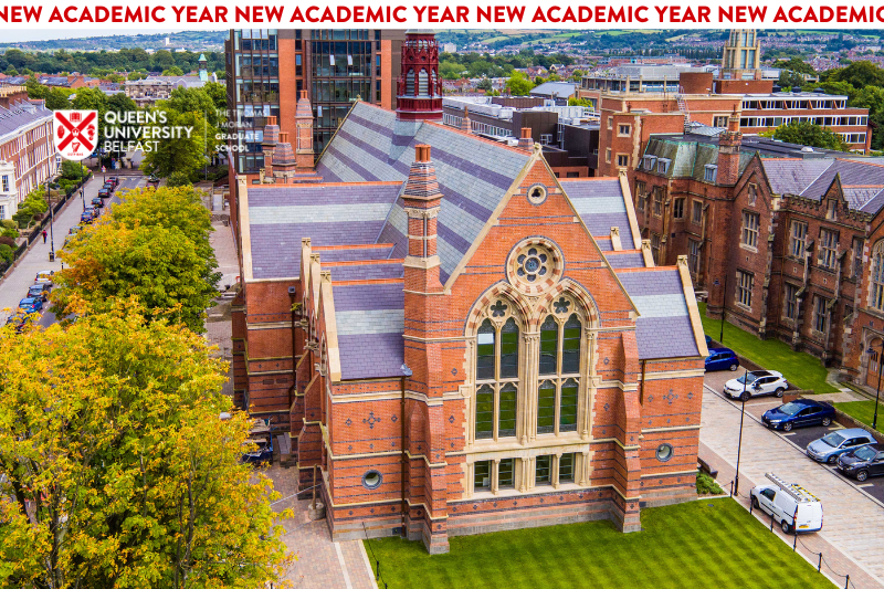 Picture of the front of the graduate school building taken from the sky. The building is old and church-like, with large stained glass windows.